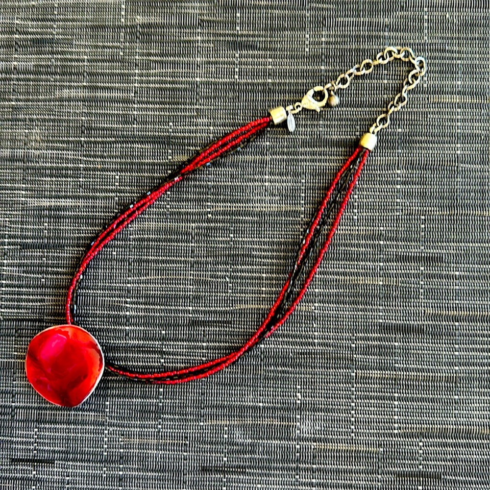 Chicos necklace in black and read beads with silver clasp.